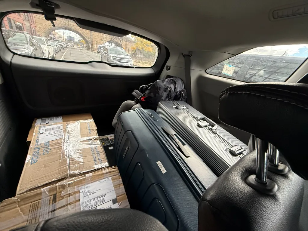 Suitcases and boxes packed in a car